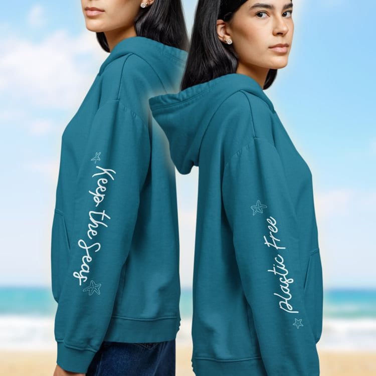 a couple of women standing next to each other on a beach